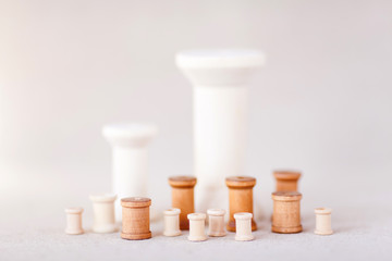 Wooden bobbins isolated on a white background