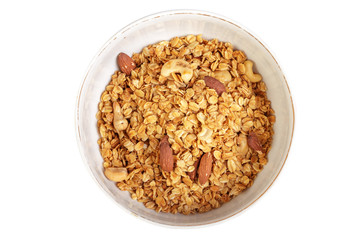 Bowl of whole grain muesli isolated on white background