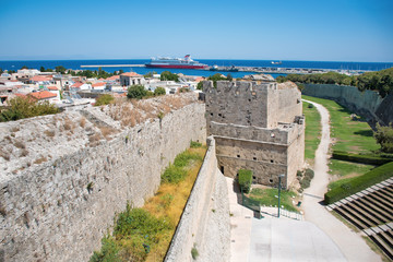 Fototapeta na wymiar View of city walls, open air theatre, and harbor in City of Rhodes (Rhodes, Greece)