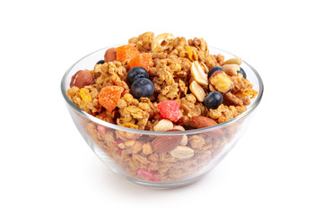 Bowl of homemade granola with fruit pieces isolated on white