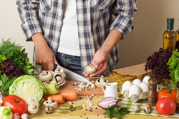 Woman cooks at the kitchen