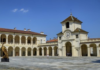 Fototapeta na wymiar Venaria Reale, Piedmont region, Italy. June 2017. Entrance to the palace of the clock tower, adjacent to the deer's fountain.
