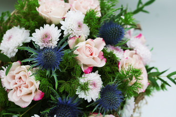 Bouquet of flowers with roses and other plants close up