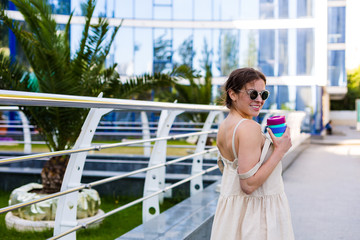 Beautiful woman walking in the summer city