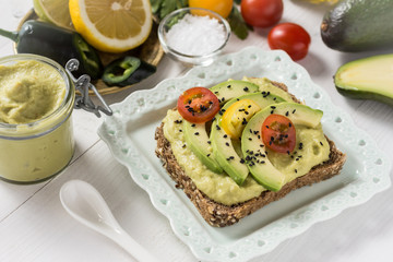 Healthy Breakfast with Fresh Avocado Spread Guacamole on Slice of Bread