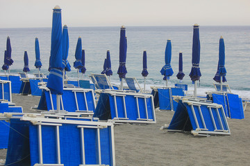 beach umbrellas closed on the beach