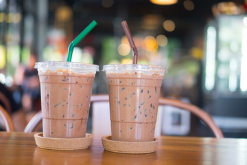Iced mocha coffee in plastic glass on the table