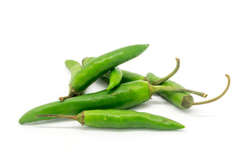 Green finger chillies against a white background