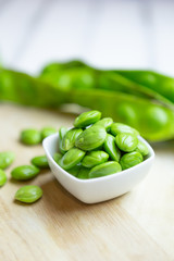 Petai, Bitter Beans on wood table, Thai vegetable food, Parkia speciosa seeds
