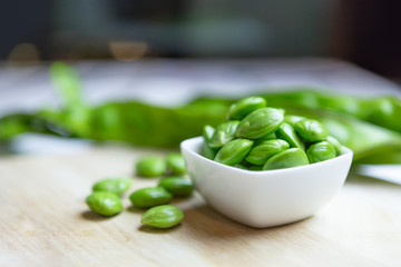 Petai, Bitter Beans on wood table, Thai vegetable food, Parkia speciosa seeds
