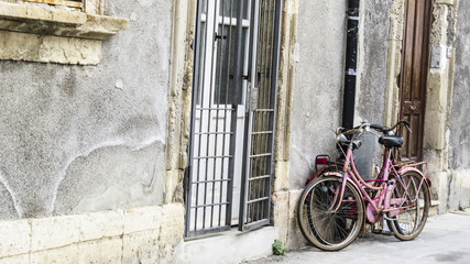 Fototapeta na wymiar View of a small typical street in Ortygia , Sicily, Italy