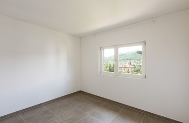 Obraz premium Empty room in a modern apartment with white walls, nobody in the scene