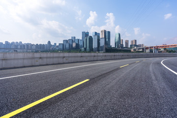 empty asphalt road with modern office building