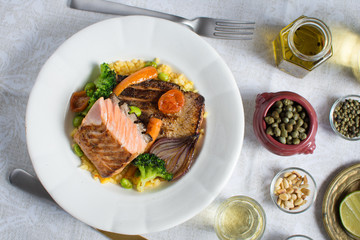 Grilled Salmon Fillet with Vegetables on White Plate