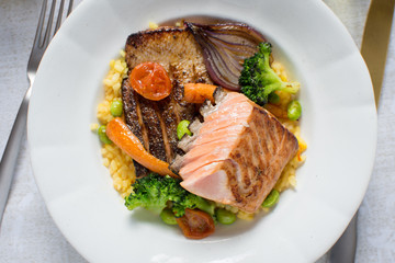 Grilled Salmon Fillet with Vegetables on White Plate