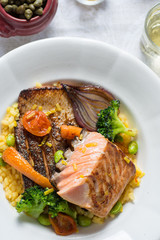 Grilled Salmon Fillet with Vegetables on White Plate