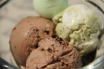chocolate and pistachio ice cream in glass vase