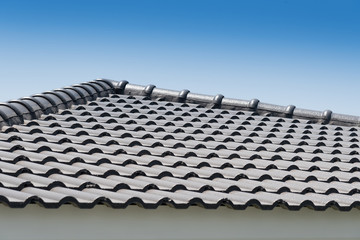 Roof tiles with sky background.