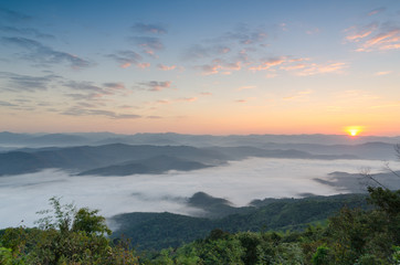 Sunset over mountains and fog. Start the first day of Easter day