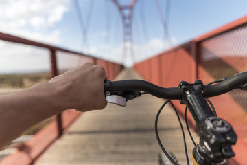 Mountain bike on pedestrian bridge.