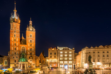 beautiful night view of the market square and the church in the center of Krakow
