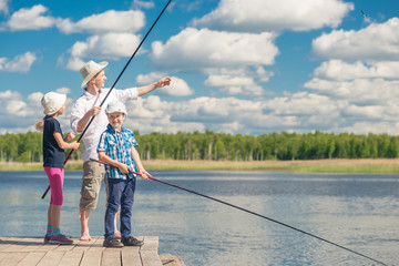 girl and boy with dad learn to fish, weekend fishing
