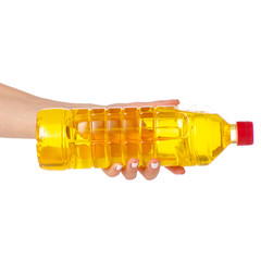 Bottle of sunflower oil in hand on white background isolation