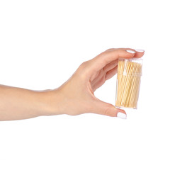 Toothpicks in hand on white background isolation
