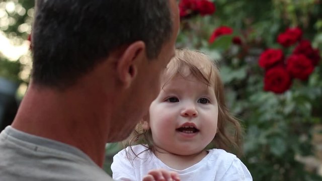 Happy father with daughter. 40+ year old father and baby