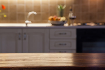 blurred kitchen interior with wooden desk space