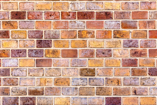 Motley old brick wall texture. Architecture background 