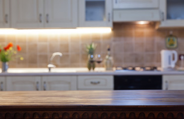 blurred kitchen interior with wooden desk space