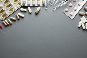 Different medicaments and empty space on gray background