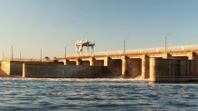 Hydro dam at water reservoir, Hydropower Plant at sunset time