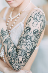 Charges of the bride in a beautiful linen dress and boudoir in the Studio. Sexy girl in a shirt with a naked body. Hair and makeup for the bride. Pre-wedding photo shoot