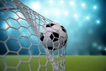 3d rendering soccer ball in goal. Soccer ball in net with spotlight and stadium light background, Success concept. Soccer ball on blue background with grass.