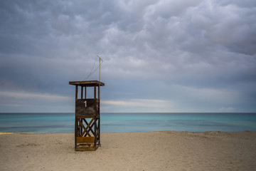 Mallorca, Sunset light on lifeguard house at sand beach on holiday island