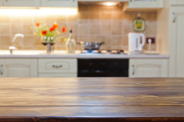 blurred kitchen interior with wooden desk space
