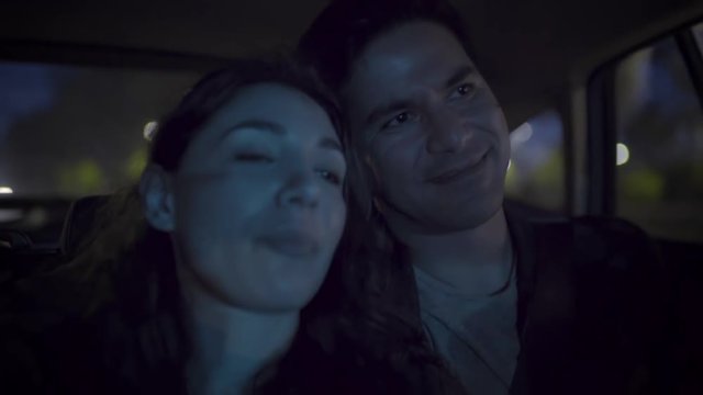Cute Couple Cuddle In Back Seat Of Car, As They Drive Through Downtown Los Angeles, CA (Slow Motion)