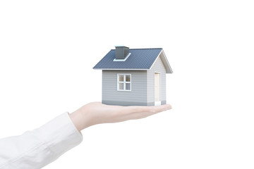 Fototapeta na wymiar Simple house in human hand isolated on white background with clipping path. Image idea of real estate and property concept. House 3D render.