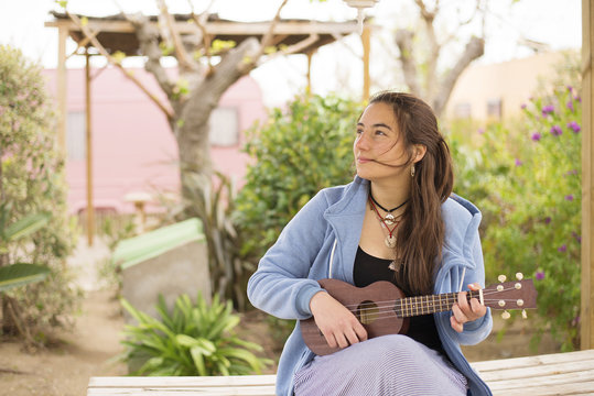 Woman playing ukelele