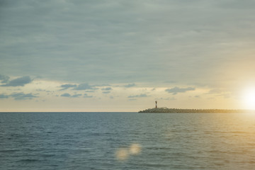 lighthouse at the sea pier sun