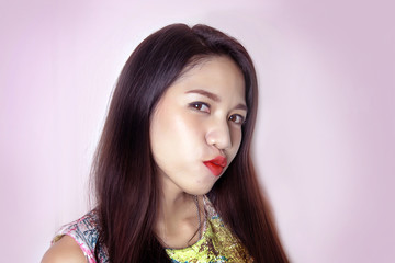 cute asian lady smile with pink lipstick on studio shot.