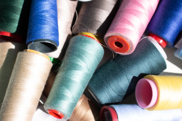 A set of colorful threads for sewing. Close up