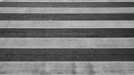 Fototapeta premium detail of a crosswalk at the asphalt road