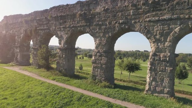 Aerial view of famous ancient roman aqueduct claudio landmark in parco degli acquedotti in rome drone slow motion dolly