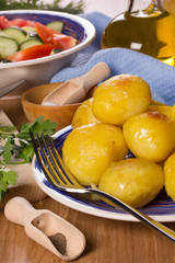 Deep-fried potatoes, salad, vegetable oil