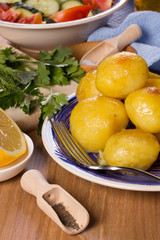 Deep-fried potatoes and salad