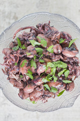 A bowl with mini squids from above.