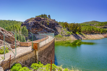 Dam at the lake Los Hornos in Gran Canaria on a clear sunny day with blue sky, Gran Canaria, Canary Islands, Spain